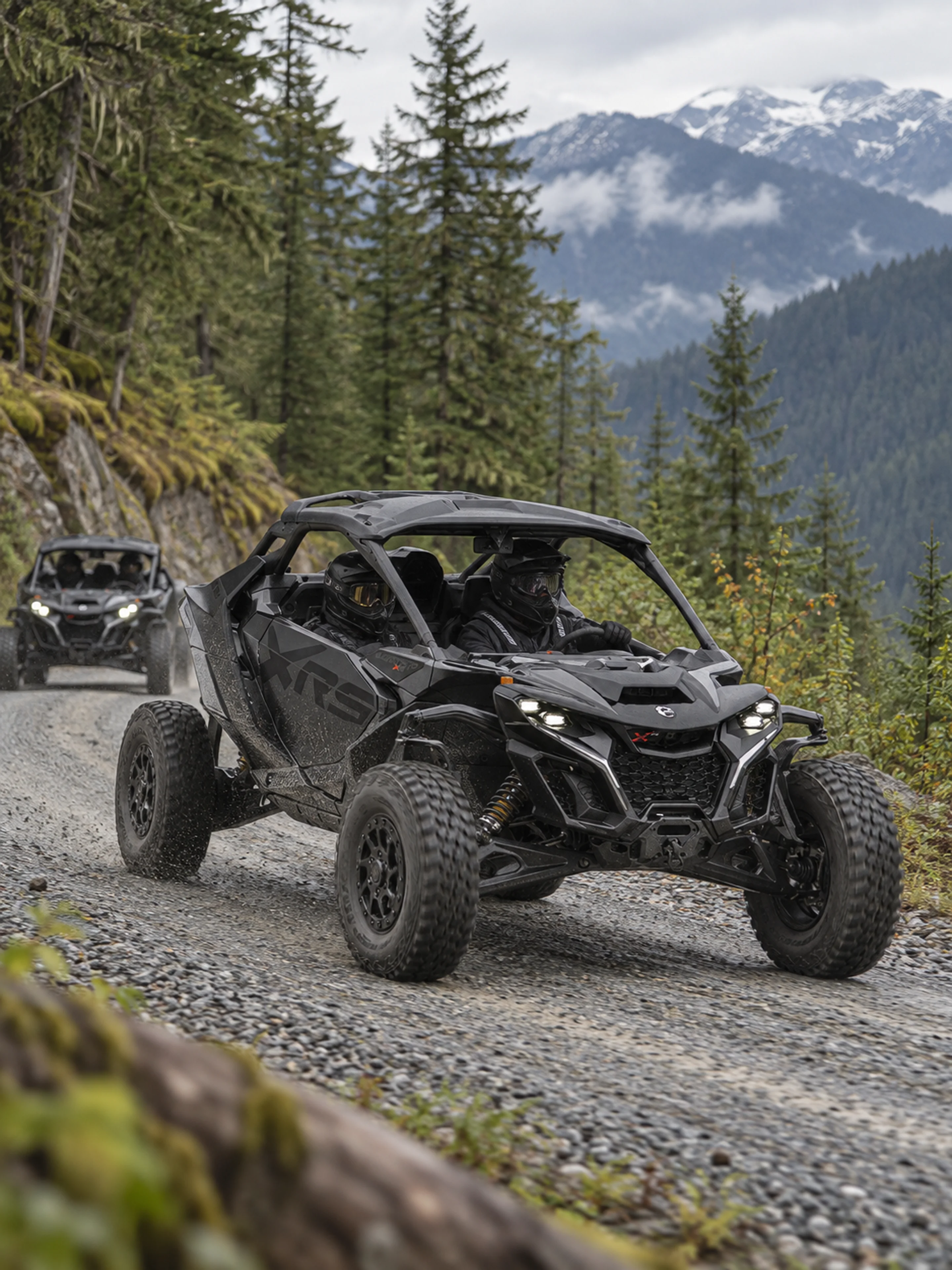 Helmeted guests drive a Can-Am Maverick R along a gravel forest road, with a second machine following.