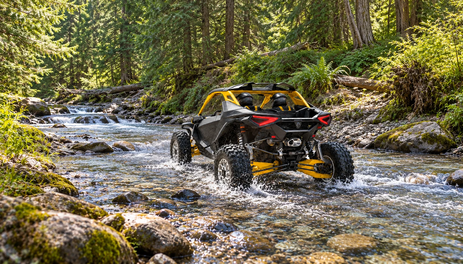 A two-seat Can-Am Maverick R crosses a shallow woodland stream with a rocky bed and mossy banks.